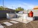 Outdoor kitchen features a built-in grill, sink, and stainless steel storage for cooking and entertaining at 13406 W Rowel Rd, Peoria, AZ 85383