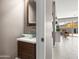 Elegant powder room featuring a unique glass sink and stylish vanity with modern fixtures at 13406 W Rowel Rd, Peoria, AZ 85383