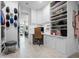 Walk-in closet with a desk and shelving, offering a dedicated space for organization and storage at 13406 W Rowel Rd, Peoria, AZ 85383