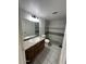 Updated bathroom showcasing a vanity, toilet, and walk-in shower with tiled walls at 14002 N 49Th Ave # 1120, Glendale, AZ 85306