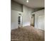 The bedroom has vaulted ceilings, doors to other rooms, and a neutral color palette at 14002 N 49Th Ave # 1120, Glendale, AZ 85306