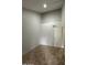 Open bedroom with tile flooring, light gray walls, and white door to the rest of the home at 14002 N 49Th Ave # 1120, Glendale, AZ 85306