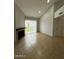 Bright living room featuring a fireplace, sliding glass doors, and tile flooring at 14002 N 49Th Ave # 1120, Glendale, AZ 85306