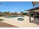 A backyard with a pool, hot tub, and covered patio for outdoor relaxation and entertainment at 14014 N 57Th Way, Scottsdale, AZ 85254