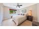 Cozy bedroom featuring a neutral color scheme, modern lighting, and wood-look floors at 14014 N 57Th Way, Scottsdale, AZ 85254