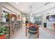 Bright, open dining area featuring tile floors, contemporary furnishings, and access to the kitchen and entrance at 14014 N 57Th Way, Scottsdale, AZ 85254