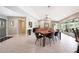 Bright, open dining room featuring tile floors, contemporary furnishings, and seamless access to the living area at 14014 N 57Th Way, Scottsdale, AZ 85254