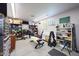 Spacious garage with ample storage, workbench, and fitness area, offering functionality and organization at 14014 N 57Th Way, Scottsdale, AZ 85254