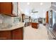 Spacious kitchen with granite countertops, stainless steel appliances, and a large center island at 14014 N 57Th Way, Scottsdale, AZ 85254