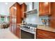Kitchen highlighting stainless steel appliances, granite countertops and wood cabinetry at 14014 N 57Th Way, Scottsdale, AZ 85254