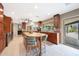 Open kitchen showcasing granite countertops, a kitchen island, and wooden cabinetry at 14014 N 57Th Way, Scottsdale, AZ 85254