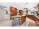 Open kitchen with granite countertops, an island with seating, and stainless steel appliances at 14014 N 57Th Way, Scottsdale, AZ 85254