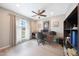 Home office featuring a ceiling fan, front windows, and plenty of light at 14014 N 57Th Way, Scottsdale, AZ 85254