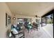 Relaxing covered patio featuring comfortable seating and a view of the pool area at 14014 N 57Th Way, Scottsdale, AZ 85254