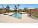 Beautiful pool and spa combo surrounded by lush landscaping and palm trees in the backyard at 14014 N 57Th Way, Scottsdale, AZ 85254