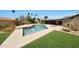 Lush backyard with a sparkling pool, spa, mature trees, and well-maintained landscaping at 14014 N 57Th Way, Scottsdale, AZ 85254