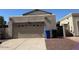 Attached garage with space for two cars, complemented by adjacent bins at 1402 E Wescott Dr, Phoenix, AZ 85024
