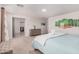This bright bedroom features natural light, neutral walls, and an ensuite bathroom at 14253 W El Cortez Pl, Surprise, AZ 85387