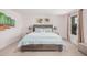 This bright bedroom features natural light, neutral walls, and coordinated decor at 14253 W El Cortez Pl, Surprise, AZ 85387