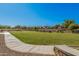 Sidewalk along manicured greenbelt, perfect for walking, jogging, and outdoor activities at 14253 W El Cortez Pl, Surprise, AZ 85387