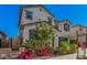 Charming two-story home in desirable neighborhood landscaped with flowering plants at 14253 W El Cortez Pl, Surprise, AZ 85387