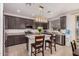 Modern kitchen features granite countertops, stainless steel appliances, and a stylish island at 14253 W El Cortez Pl, Surprise, AZ 85387