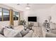 Cozy living room with large windows and comfortable seating, perfect for relaxing at 14253 W El Cortez Pl, Surprise, AZ 85387