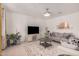 Comfortable living room featuring a neutral palette, TV, and stylish decor at 14253 W El Cortez Pl, Surprise, AZ 85387