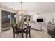 Open-concept living room and dining area with plenty of natural light, ideal for Gathering gatherings at 14253 W El Cortez Pl, Surprise, AZ 85387