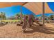Community playground featuring a shaded slide and climbing structure for entertainment at 14253 W El Cortez Pl, Surprise, AZ 85387
