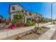 Beautiful single Gathering home is located in a desirable neighborhood and landscaped with flowering plants at 14253 W El Cortez Pl, Surprise, AZ 85387