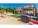 Enjoy outdoor living in this backyard with a patio, artificial grass, and playground at 14604 W Banff Ln, Surprise, AZ 85379