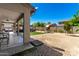 Spacious backyard with covered patio and playground at 14604 W Banff Ln, Surprise, AZ 85379