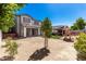 Large backyard featuring playground, covered patio, and nice landscaping at 14604 W Banff Ln, Surprise, AZ 85379