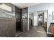 Beautiful bathroom featuring a walk-in shower and double sinks with a granite top at 14604 W Banff Ln, Surprise, AZ 85379