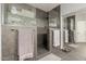 Modern bathroom with a glass-enclosed shower featuring stylish tile and sleek fixtures at 14604 W Banff Ln, Surprise, AZ 85379