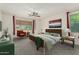 Staged bedroom with a comfortable bed, soft lighting, and stylish decor at 14604 W Banff Ln, Surprise, AZ 85379