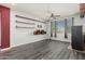Large bonus room featuring floating shelves and a ceiling fan at 14604 W Banff Ln, Surprise, AZ 85379