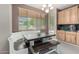 Charming dining area featuring built-in benches and a dark wood table at 14604 W Banff Ln, Surprise, AZ 85379