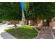 Well-maintained two-story home with verdant lawn and stone-accented facade at 14604 W Banff Ln, Surprise, AZ 85379