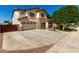 Two-story stucco home with stone accents, attached garage and extended driveway at 14604 W Banff Ln, Surprise, AZ 85379