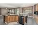 Kitchen island boasts granite countertops and stainless steel dishwasher at 14604 W Banff Ln, Surprise, AZ 85379