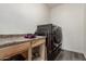 Well-organized laundry area featuring modern washer/dryer and counter space at 14604 W Banff Ln, Surprise, AZ 85379