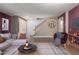 Staged living room with a comfortable sofa, coffee table, and cozy decor elements at 14604 W Banff Ln, Surprise, AZ 85379