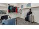 Spacious walk-in closet providing ample storage for clothing, luggage, and accessories at 14604 W Banff Ln, Surprise, AZ 85379