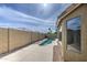 Private backyard features a shimmering pool, and privacy fence at 15067 W Taylor St, Goodyear, AZ 85338