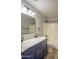 Stylish bathroom featuring a double vanity, and a bright walk-in shower at 15067 W Taylor St, Goodyear, AZ 85338