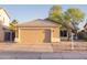 Inviting single-Gathering home featuring a neutral color palette, desert landscaping, and an attached two car garage at 15067 W Taylor St, Goodyear, AZ 85338