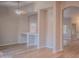 Open-concept living room featuring modern lighting, light flooring, and an inviting design at 15067 W Taylor St, Goodyear, AZ 85338