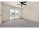 Bedroom with carpet floors, a ceiling fan, and a door to the outside at 16336 E Palisades Blvd # 4, Fountain Hills, AZ 85268